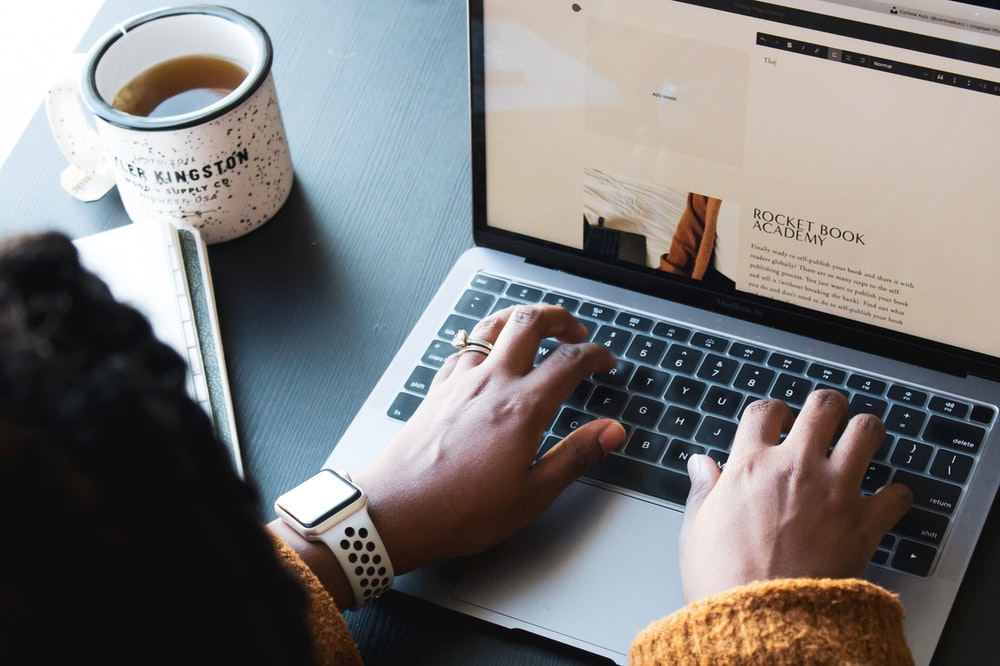 A person typing on a laptop.