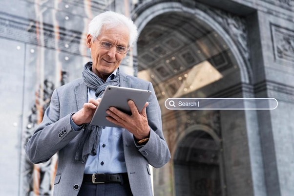 A close-up of a person using a laptop with a digital brain icon on the screen, representing AI integration in search technology.